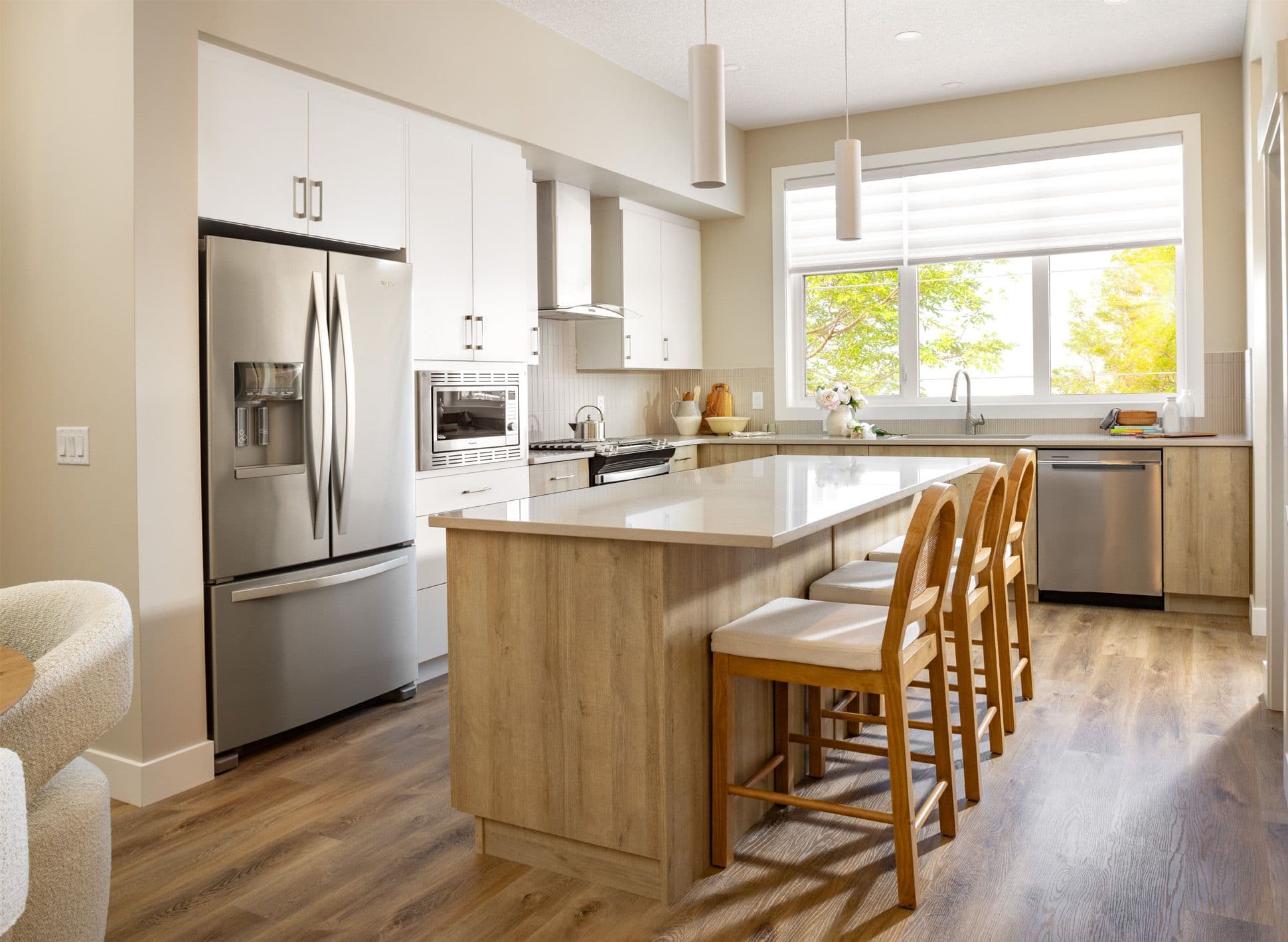 An L-shaped kitchen full of natural light.